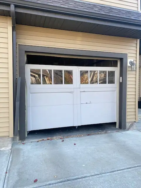 An off track garage door that needs repair